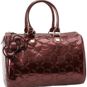 Vintage burgundy lounge fly, hello Kitty purse and wallet.